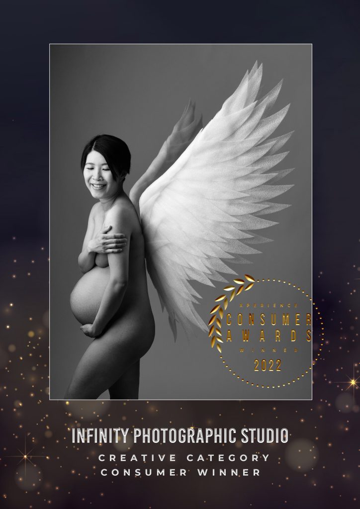Award winning maternity photograph, incorporating angel wings by Infinity Photographic Studios