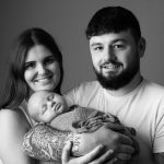 New family with their baby at a photoshoot