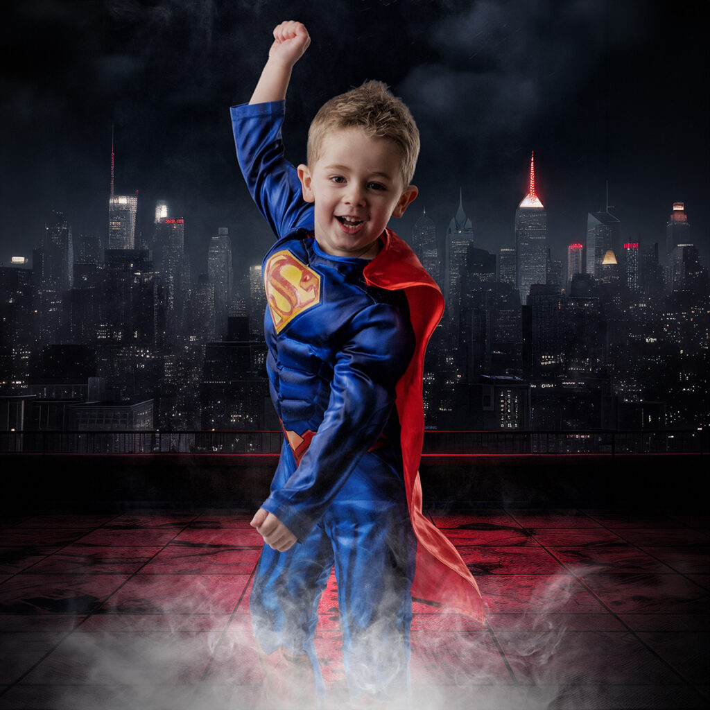 Little boy jumping as superman enjoying The Hero Experience
