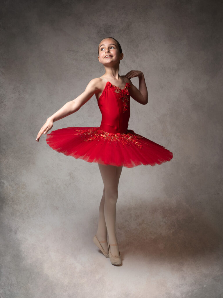 Photo of a girl in a red tutu dance photoshoot