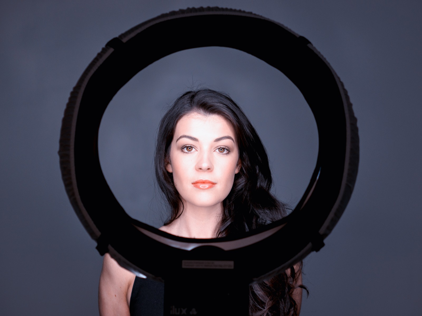 Woman framed by a studio ring light